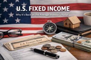 Desk scene with a U.S. flag background, U.S. Treasury Bond certificate, stack of dollar bills, coins, pen, compass, glasses, and a small house model, highlighting U.S. fixed income investments and why bonds are returning to the average investor’s radar.